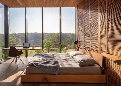 Ristrutturazione in bioedilizia di camera da letto con vetrata.